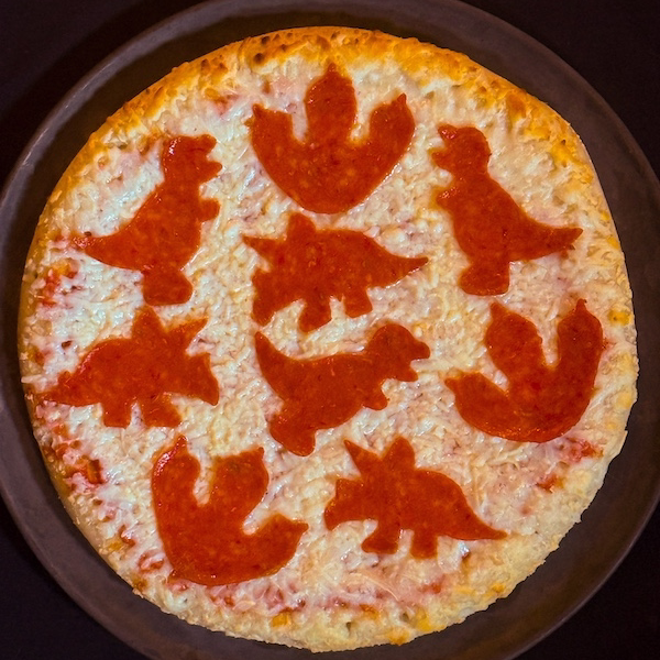 Dinosaur pepperoni pizza